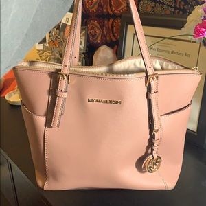 Rose gold a Michael Kors purse